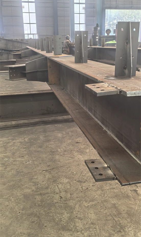 Fabricated steel members stored in a workshop reference